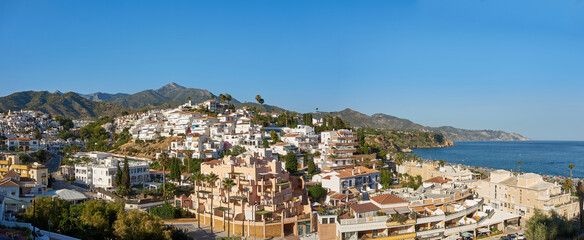 Panoramic view of Burriana beach located in Nerja famous for the nearby cliffs and the beach bars where you can eat paella and typical dishes of the area