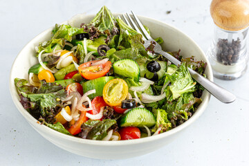 Healthy Cucumber and Tomato Salad in a Bowl Close Up Horizontal Photo
