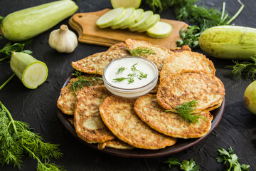 A healthy breakfast of zucchini pancakes. Creative atmospheric decoration