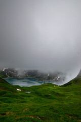 Lünersee surrounded by misty mountains (Vorarlberg, Austria)