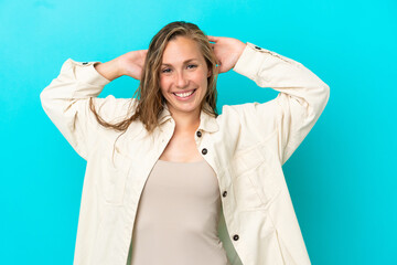 Fototapeta premium Young caucasian woman isolated on blue background laughing