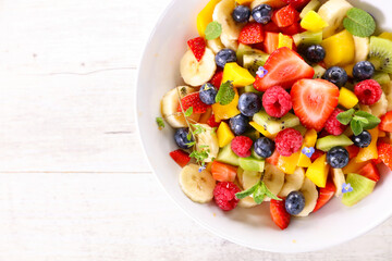 Obraz na płótnie Canvas fresh fruit salad- top view