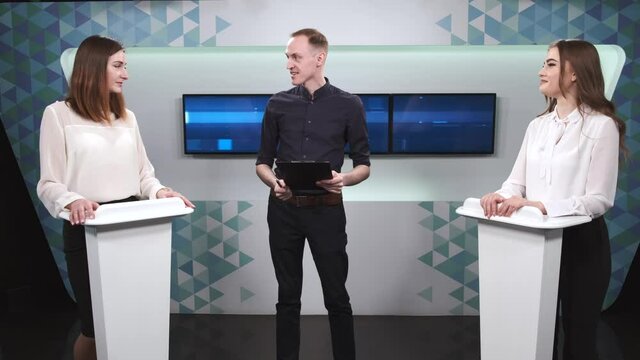 Tv host and two participants on game show