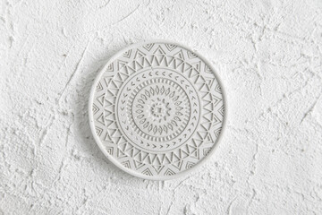 Decor Home Gypsum. Handmade Concrete. Round Coffe Coaster on Concrete background. White Plate on white background. Concrete plate mock up. Template for product placement. top view, copy space.
