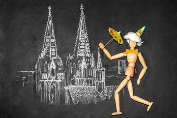 Celebrating man against the background of Cologne Cathedral drawn on chalkboard