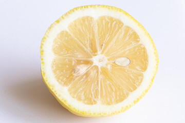 Lemon on a light background. Lemon is added to tea. 