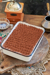 Homemade tiramisu. Wooden background. Side view. Cake and coffee.
