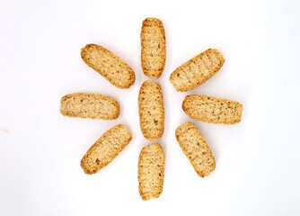 Oval slices of toasted bread used for italian appetizers as Crostino o Bruschetta , adding then a topping above. White background.