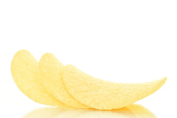 Delicious light yellow potato chips, close-up, isolated on white.