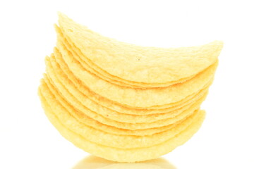 Delicious light yellow potato chips, close-up, isolated on white.
