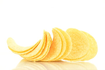 Delicious light yellow potato chips, close-up, isolated on white.