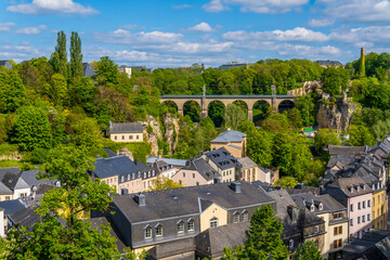 Fototapeta na wymiar Panoramic view of the lower city of Luxembourg-City with medieval houses and viaduct in the background