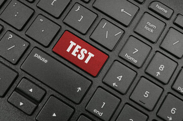 Laptop keyboard with test button	