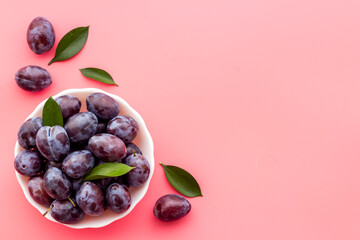 Purple cherry plums layout. Food fruits background. Top view