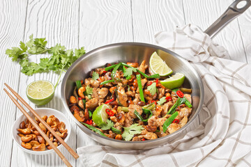 Thai cashew chicken stir fry in a pan