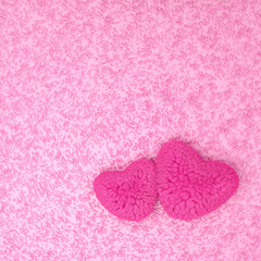 Fototapeta na wymiar Pink heart-shaped pillows on the carpet