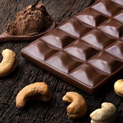 CHOCOLATE WITH CASHEW NUTS AND COCOA POWDER INTO A SPOON