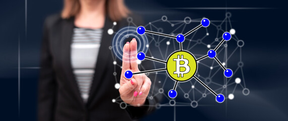 Woman touching a bitcoin concept