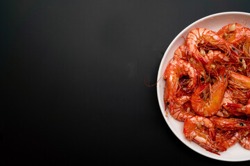 Delicious fried tiger prawns with minced garlic on the plate