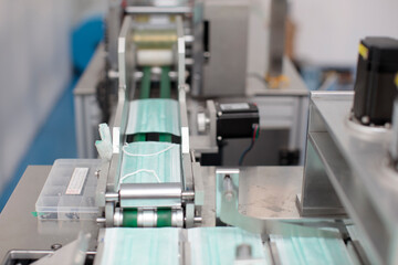 Industry and factory concept, medical face mask production line.