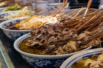 Spicy kebabs with seasoning in the bowl