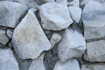 wall of white large stone with cement