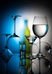 Glass goblets on blurred gradient background