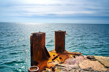 Corrosion of metal. Rusty bollard.