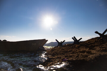 World War 2 reenactment (D-day). Creative decoration with toy soldiers, landing crafts and hedgehogs. Battle scene of Normandy landing on June 6, 1944.