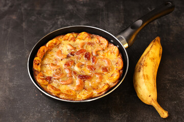 Malabar banana cake kayappola , pazham pola , banana pie made in skillet pan pie pot pie fruitcake made with eggs and Kerala banana for Ramadan, Eid . tea time snack breakfast dessert India Sri Lanka 