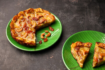 Malabar banana cake kayappola , pazham pola , banana pie made in skillet fruitcake made with eggs and Kerala banana for Ramadan, Eid . tea time snack breakfast dessert India Sri Lanka 