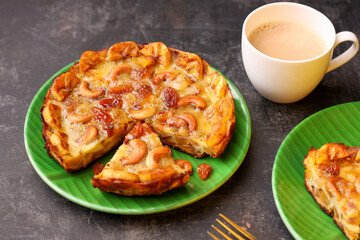 Malabar banana cake kayappola, Indian milk tea  pazham pola , banana pie made in skillet fruitcake made with eggs and Kerala banana for Ramadan, Eid . tea time snack breakfast dessert India Sri Lanka 