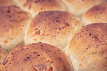 Close-up of freshly cooked breads. Food based on wheat flour.