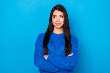 Fototapeta premium Photo portrait young girl smiling with folded hands looking empty space dreamy isolated bright blue color background