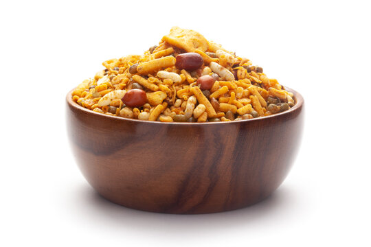 Close up of spicy Ratlami mixture Indian namkeen (snacks) In hand-made (handcrafted) wooden bowl.