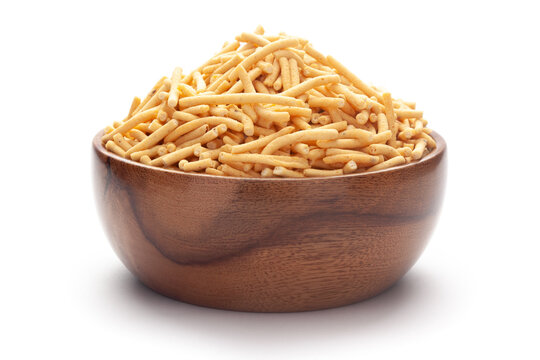 Close up of Marwadi Bhujiya Indian namkeen (snacks) In hand-made (handcrafted) wooden bowl