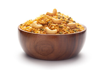 Close-Up of Hot spicy Kashmiri Mixture (Namkeen) snacks In hand-made (handcrafted) wooden bowl made with dry fruits, peanuts,. Indian spicy snacks,