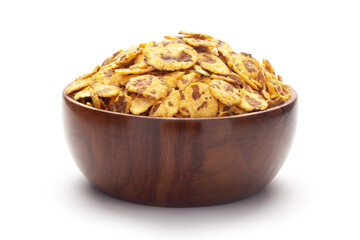 Close-up of Spicy Chana Jor Garam In hand-made (handcrafted) wooden bowl, made with air-fried Bengal Chickpea. Pile of Indian spicy snacks (Namkeen),