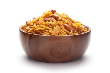 Close-Up of Spicy Chatpata Mixture In hand-made (handcrafted) wooden bowl made with peanuts, corn flakes. Indian spicy snacks (Namkeen)