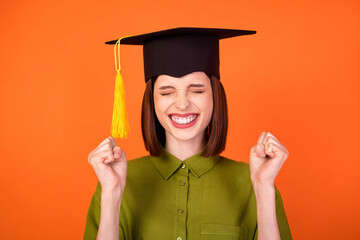 Photo of hooray bob hairdo young lady hands fists wear headwear khaki shirt isolated on orange color background - obrazy, fototapety, plakaty