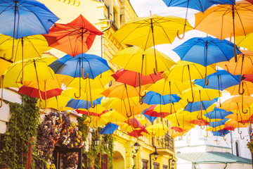Fototapeta na wymiar Street decorated with colorful umbrellas