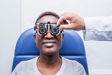 Black woman in optometry cabinet