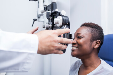 Black woman in optometry cabinet