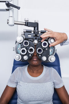 Black woman in optometry cabinet
