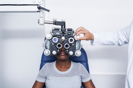 Black woman in optometry cabinet