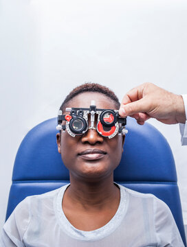 Black woman in optometry cabinet