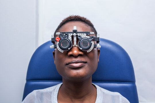 Black woman in optometry cabinet