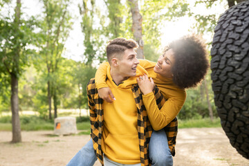 Young diverse couple having fun in nature