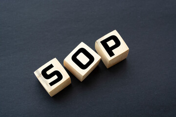 SOP - acronym from wooden blocks with letters, abbreviation SOP standard operating procedure...
