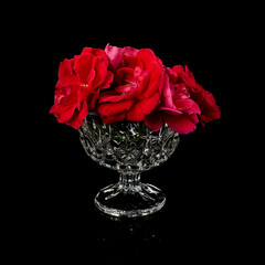 antique crystal rose bowl on black background